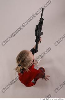 DENISA KNEELING POSE WITH GUN